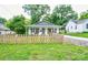 Charming home with a picket fence, covered porch, and well-maintained front lawn at 812 Kings Rd, Shelby, NC 28150