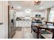 Bright kitchen with stainless steel refrigerator, all-white cabinetry, and modern appliances, perfect for cooking at 812 Kings Rd, Shelby, NC 28150