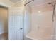 Bathroom shower and tub with white tile surround at 8255 Castor Rd, Salisbury, NC 28146