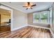 Neutral bedroom with hardwood floors and natural light from the windows at 8255 Castor Rd, Salisbury, NC 28146