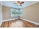 Bedroom features hardwood floors, neutral walls, and large windows at 8255 Castor Rd, Salisbury, NC 28146