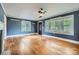 Bright living room featuring hardwood floors, a ceiling fan, and plenty of natural light at 8255 Castor Rd, Salisbury, NC 28146