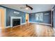 Comfortable living room showcases a fireplace, hardwood floors, and neutral decor at 8255 Castor Rd, Salisbury, NC 28146