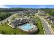 Aerial view showcases the community clubhouse and pool amenities, surrounded by well-maintained homes at 9435 Liberty Hill Dr, Mint Hill, NC 28227