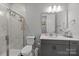 Modern bathroom featuring a glass-enclosed shower with marble tile, sleek vanity, and contemporary fixtures at 9435 Liberty Hill Dr, Mint Hill, NC 28227
