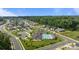 Aerial view of community pool, clubhouse and surrounding neighborhood at 9435 Liberty Hill Dr, Mint Hill, NC 28227