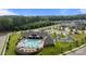 Aerial view of community pool, clubhouse, pickleball court, and surrounding neighborhood at 9435 Liberty Hill Dr, Mint Hill, NC 28227