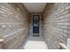 Charming entryway showcasing a classic front door with decorative wreath and a 'Welcome' mat for a warm greeting at 9435 Liberty Hill Dr, Mint Hill, NC 28227