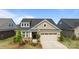 Charming single-Gathering home with a brick facade, two-car garage, and landscaped front yard at 9435 Liberty Hill Dr, Mint Hill, NC 28227