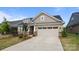 Charming single-Gathering home with a brick facade, two-car garage, and landscaped front yard at 9435 Liberty Hill Dr, Mint Hill, NC 28227
