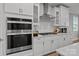 Well-equipped kitchen with stainless steel appliances, gas cooktop, ample counter space, and modern white cabinetry at 9435 Liberty Hill Dr, Mint Hill, NC 28227