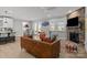 Bright living area with a stone fireplace, large windows, and an adjacent dining space at 9435 Liberty Hill Dr, Mint Hill, NC 28227