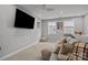 Relax in this inviting loft with a comfortable sofa, plush pillows, and a large screen TV for ultimate entertainment at 9435 Liberty Hill Dr, Mint Hill, NC 28227
