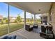 Relaxing screened porch with comfortable seating, overlooking a lush backyard perfect for enjoying the outdoors at 9435 Liberty Hill Dr, Mint Hill, NC 28227