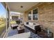 Inviting screened porch featuring comfortable seating, a ceiling fan, and views of the backyard at 9435 Liberty Hill Dr, Mint Hill, NC 28227