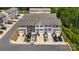 Aerial view of townhomes with ample parking and beautiful green surroundings at 999 Rushing Ln # 13, Fort Mill, SC 29715