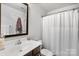 This bathroom boasts an updated vanity with modern fixtures and a shower with a curtain at 999 Rushing Ln # 13, Fort Mill, SC 29715