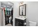 This bathroom offers an open closet and modern vanity with black cabinets at 999 Rushing Ln # 13, Fort Mill, SC 29715