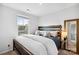 Cozy bedroom featuring a large bed, window view, and stylish nightstand decor at 999 Rushing Ln # 13, Fort Mill, SC 29715