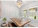 Dining room featuring a wood table, bench seating, and a stylish chandelier at 999 Rushing Ln # 13, Fort Mill, SC 29715