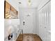 Bright entryway with white walls, wood floor, and decorative Vineyard Farmhouse sign at 999 Rushing Ln # 13, Fort Mill, SC 29715