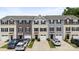 Street view of townhouses with landscaping, driveways, and attached garages at 999 Rushing Ln # 13, Fort Mill, SC 29715