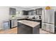 Modern kitchen featuring stainless steel appliances, dark cabinets, and an island at 999 Rushing Ln # 13, Fort Mill, SC 29715