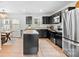 Bright kitchen with stainless steel appliances and an island open to the dining area at 999 Rushing Ln # 13, Fort Mill, SC 29715