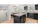 Well-lit kitchen with a center island that opens to the dining area at 999 Rushing Ln # 13, Fort Mill, SC 29715