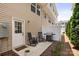 Back patio with grill and rocking chairs outside the back door at 999 Rushing Ln # 13, Fort Mill, SC 29715