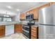Well-appointed kitchen featuring stainless steel appliances, granite countertops, and ample cabinet space at 10223 Reindeer Way Ln, Charlotte, NC 28216