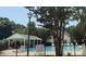 Community pool featuring ample seating and a covered area, perfect for relaxation at 10223 Reindeer Way Ln, Charlotte, NC 28216