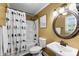 Clean bathroom featuring a shower, toilet, and pedestal sink at 110 Heritage Dr, Kings Mountain, NC 28086