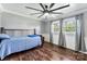 Bedroom with hardwood floors, two windows and a ceiling fan at 110 Heritage Dr, Kings Mountain, NC 28086