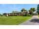 Sprawling lawn surrounds this single-story brick home, set back on lot, with detached garage and long driveway at 110 Heritage Dr, Kings Mountain, NC 28086
