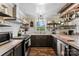 Stylish kitchen with sleek countertops, stainless steel appliances, open shelving, and rustic wood accents at 110 Heritage Dr, Kings Mountain, NC 28086