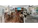 Cozy living room area featuring wood floors, fireplace, large brick hearth, and lots of natural light at 110 Heritage Dr, Kings Mountain, NC 28086