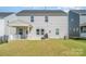 Spacious backyard with a covered patio, perfect for outdoor entertaining at 11116 Godwit Ln, Charlotte, NC 28278