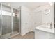 Modern bathroom with a glass-enclosed shower, double vanity with quartz countertop, and stylish fixtures at 11116 Godwit Ln, Charlotte, NC 28278