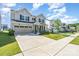 Beautiful two-story home with a long driveway and manicured front lawn at 11116 Godwit Ln, Charlotte, NC 28278