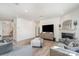 Bright living room with a fireplace, modern decor, and open floor plan at 11116 Godwit Ln, Charlotte, NC 28278