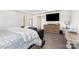 Relaxing main bedroom with furniture including a large bed, dresser, and TV at 11116 Godwit Ln, Charlotte, NC 28278
