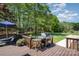 Lovely backyard deck with lounge chairs, a grill, and view of the expansive backyard at 127 Fantasy Ln, Mooresville, NC 28117
