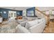 Open-concept living room with hardwood floors and staircase access at 127 Fantasy Ln, Mooresville, NC 28117