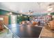 Large recreation room with ping pong table, shelving, sitting area, and lots of natural light at 127 Fantasy Ln, Mooresville, NC 28117