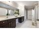 Spacious bathroom with double sinks, granite counters, white marble floors, and a glass-enclosed shower at 129 Hawks Creek Pkwy, Fort Mill, SC 29708