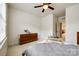 Bright bedroom with neutral walls, a ceiling fan, and a glimpse into another room at 129 Hawks Creek Pkwy, Fort Mill, SC 29708