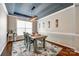 Cozy dining room featuring stylish decor, ample natural light, and a unique ceiling design at 129 Hawks Creek Pkwy, Fort Mill, SC 29708