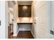 This home entry features a stylish built-in desk, wooden floors, and a convenient space for organization at 129 Hawks Creek Pkwy, Fort Mill, SC 29708