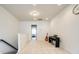 Bright hallway featuring neutral walls, a piano, and a glimpse into a bedroom at 129 Hawks Creek Pkwy, Fort Mill, SC 29708
